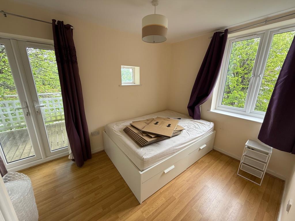 Lot: 58 - FLAT FOR INVESTMENT - Bedroom with doors to balcony
